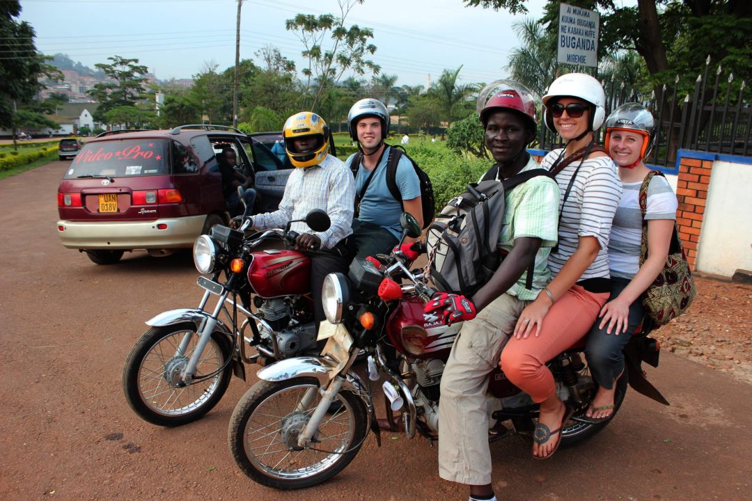 tourists on a boda boda.Boda Boda Tour in Kampala